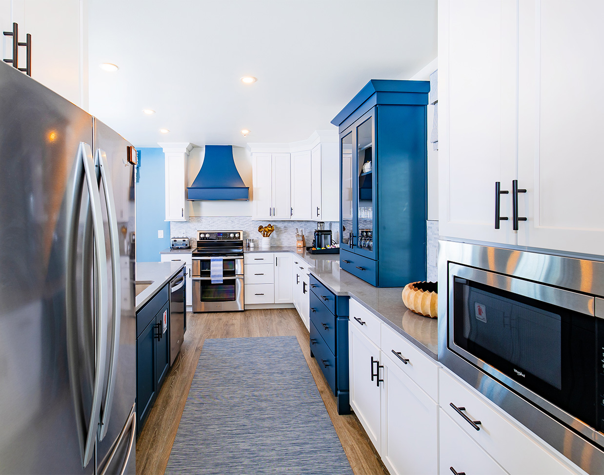 Modern blue and white cottage kitchen at The Inn at Stonecliffe, one of the upscale Mackinac Island hotels.