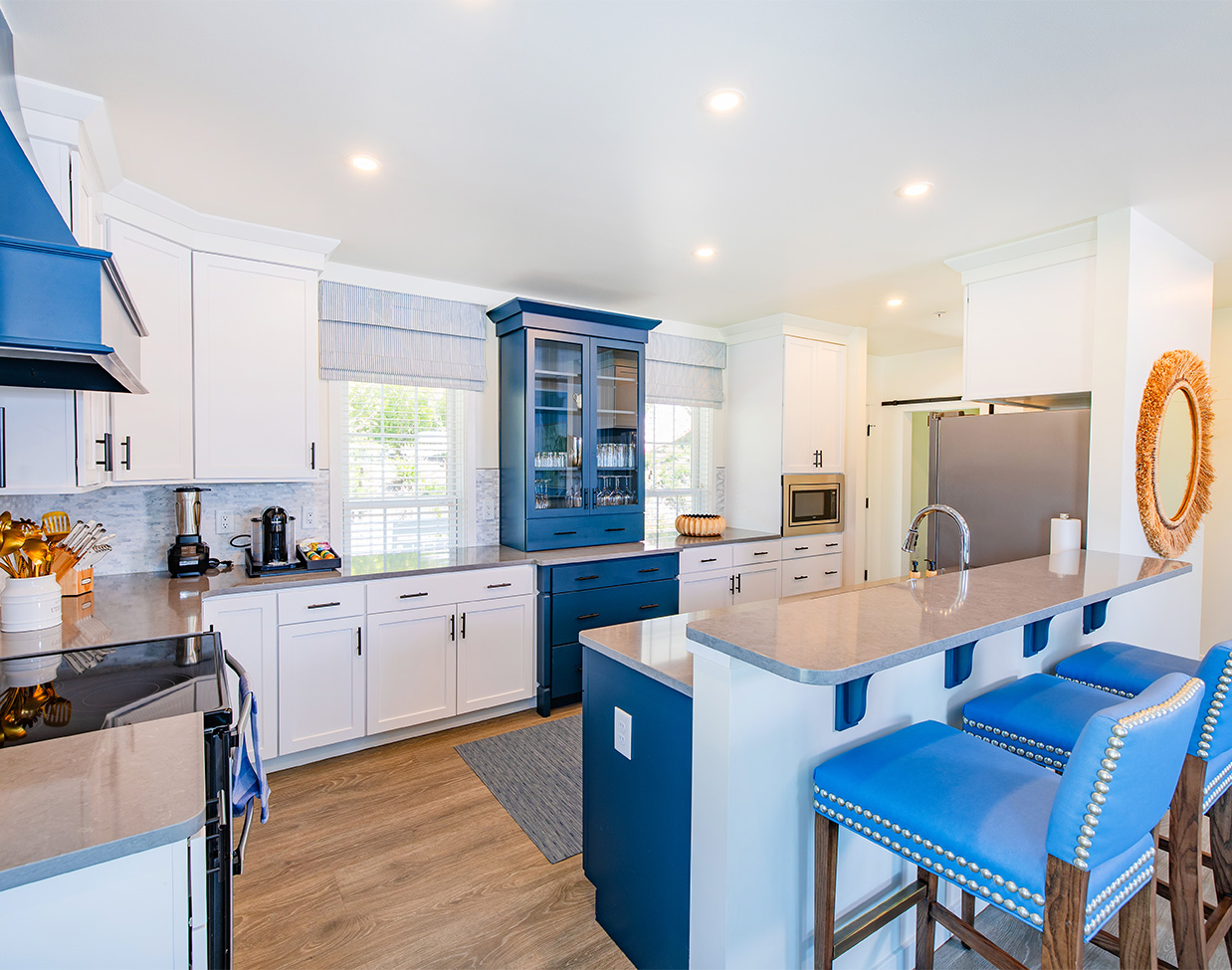 Spacious blue-accented cottage kitchen at The Inn at Stonecliffe, one of the luxury Mackinac Island hotels.