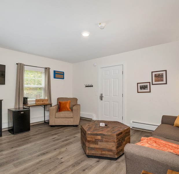 a living room with a couch and a table