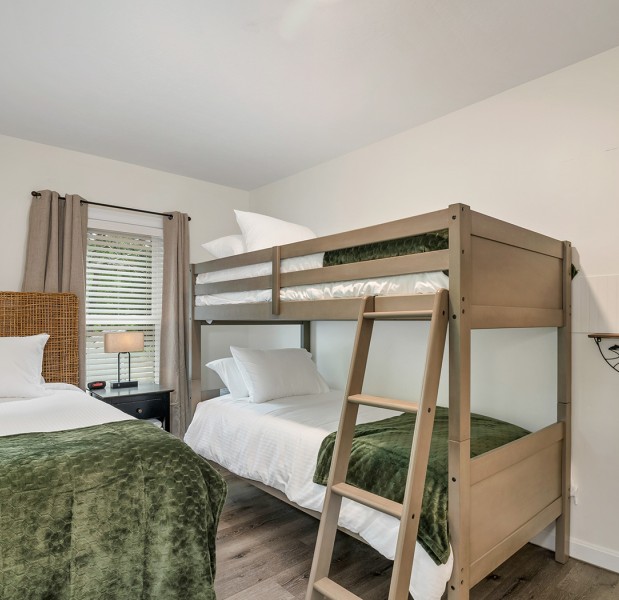 a couple of beds in a room