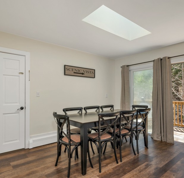 a dining room with a table and chairs