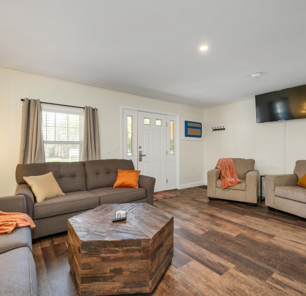 a living room with couches and a coffee table