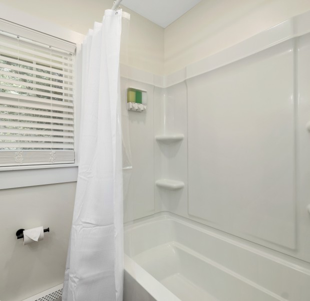 a bathroom with a shower curtain