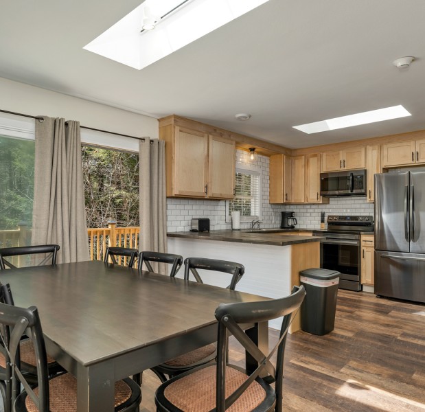 a kitchen with a table and chairs