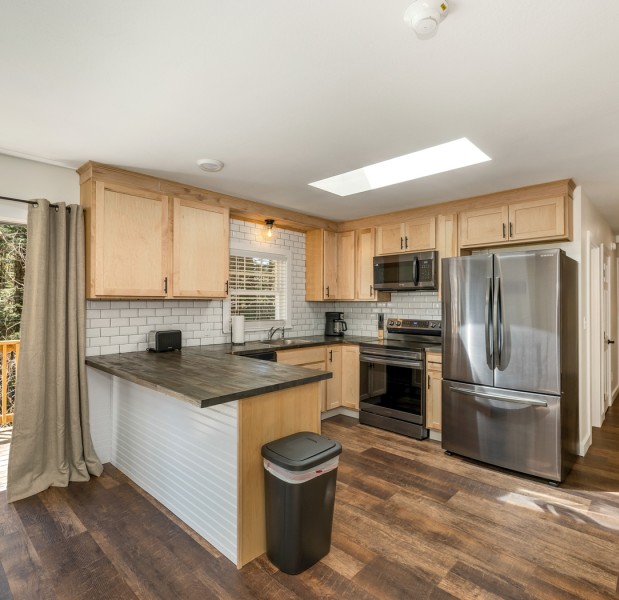 a kitchen with wooden cabinets