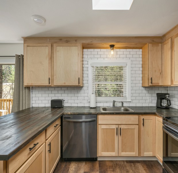 a kitchen with wooden cabinets
