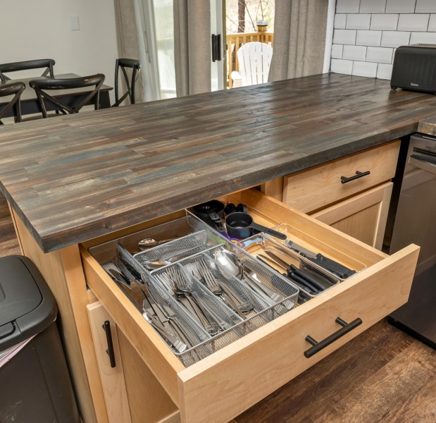 a wooden table with a metal tray on it