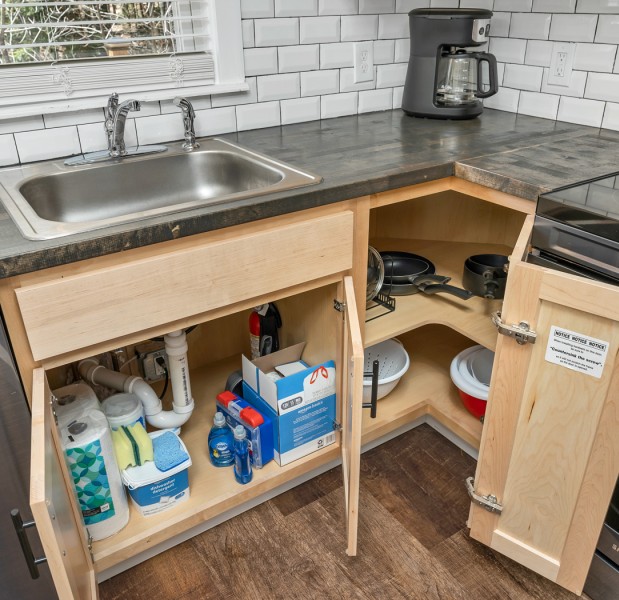 a kitchen with a sink and a stove