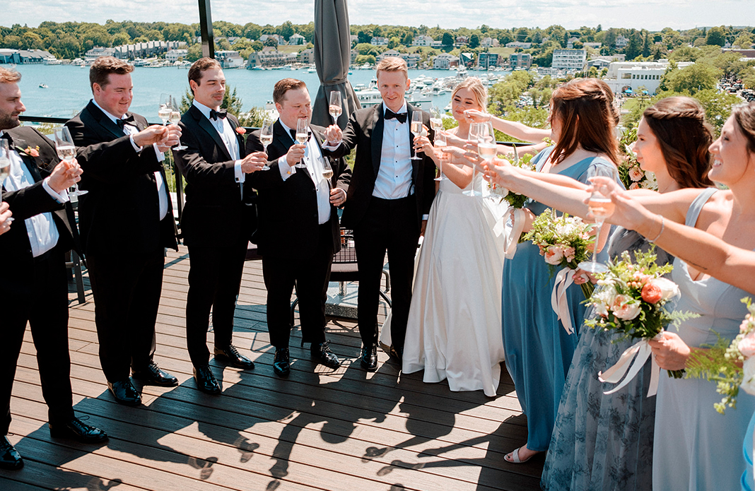 a group of people holding champagne glasses