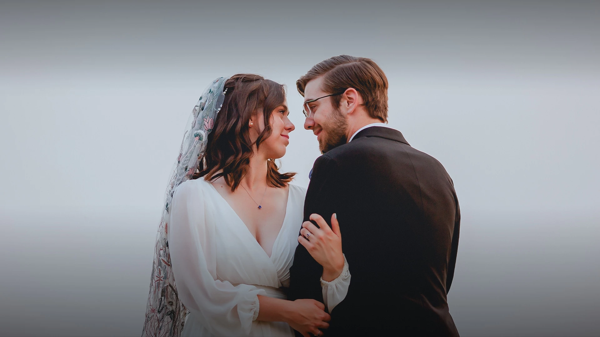 a man and woman in wedding attire