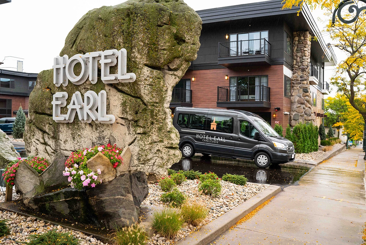 a black van parked in front of a hotel