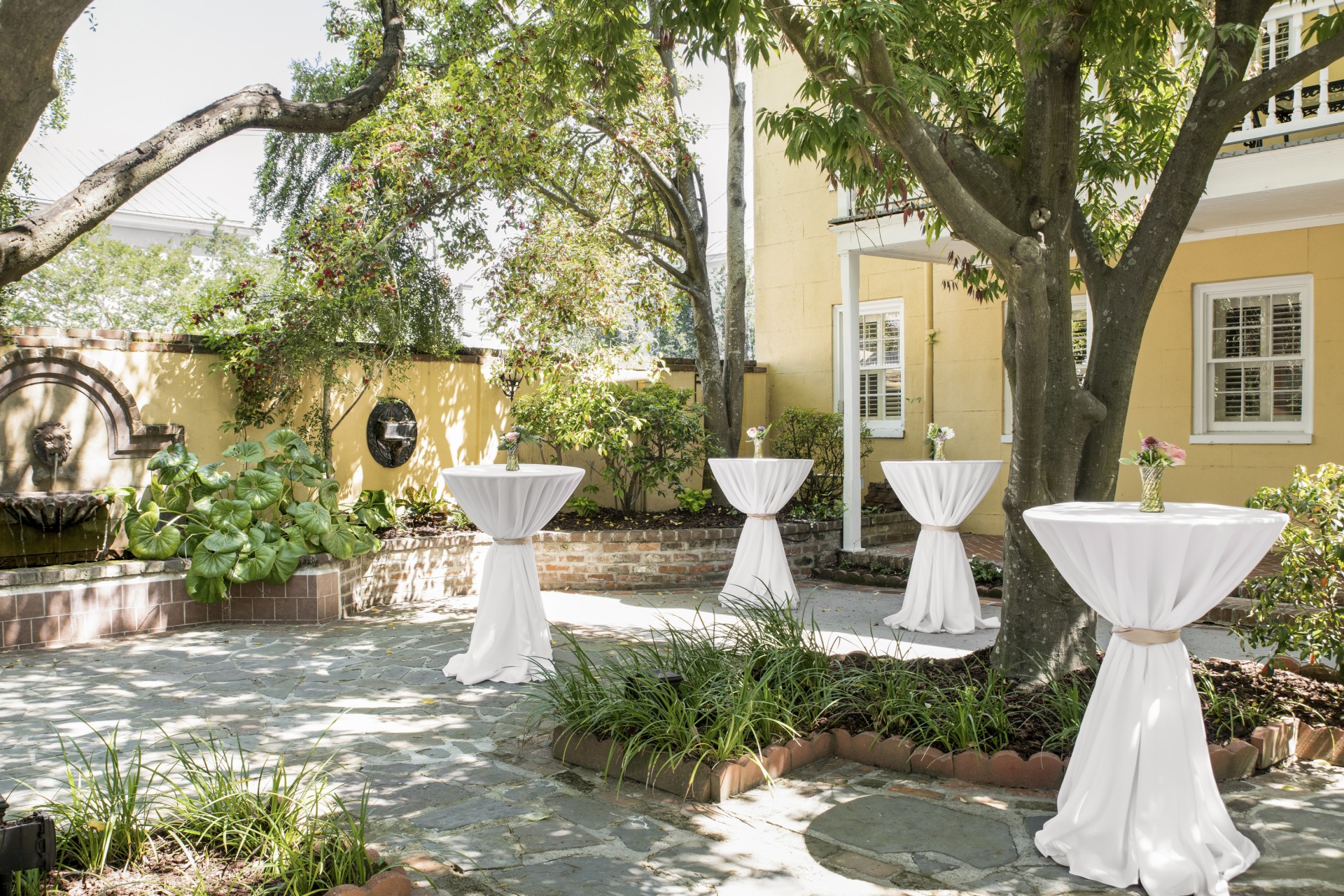 a group of tables covered in white cloth