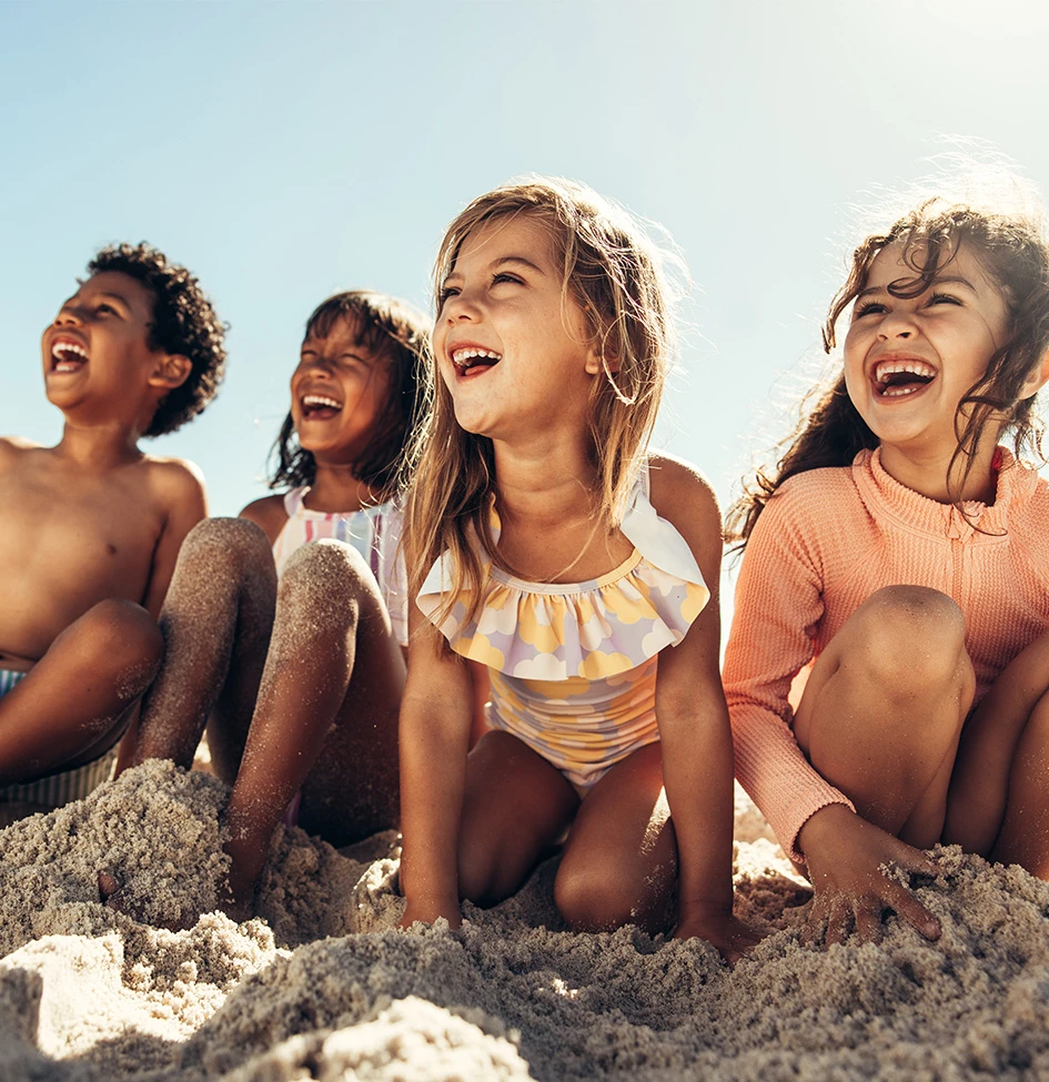 a group of kids on the beach