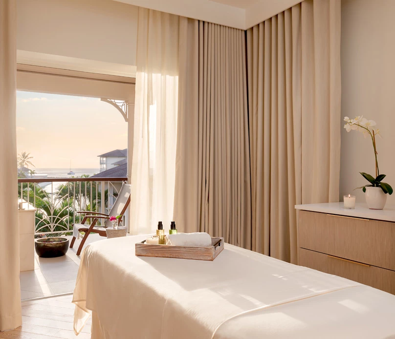a massage table in a room with a balcony