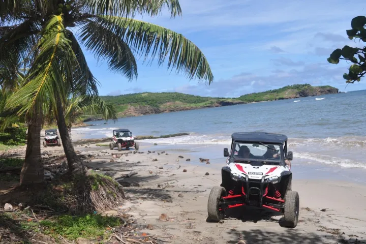 two vehicles on a beach