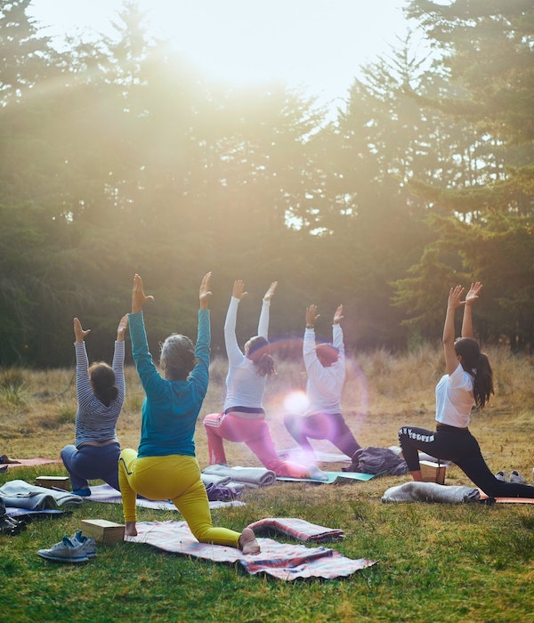 group doing yoga outdoors