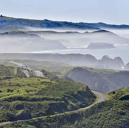 view of a windy road through the mountains
