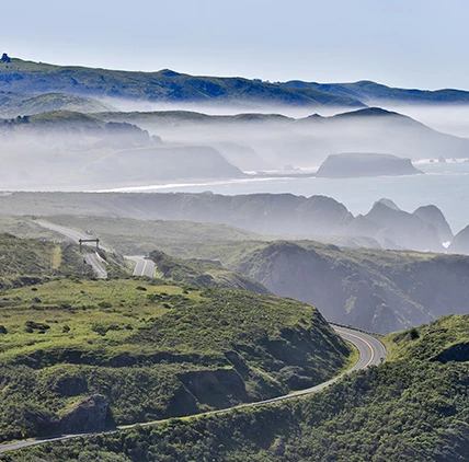 view of a windy road through the mountains