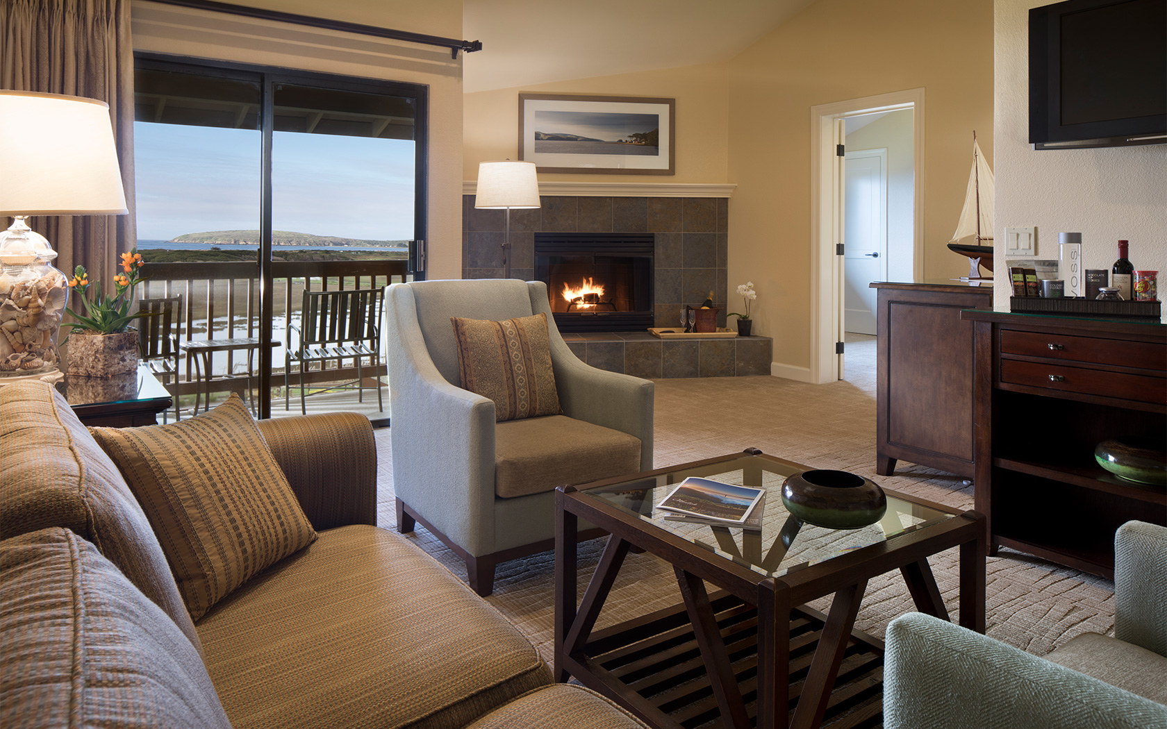 large hotel suite with a defined living room space