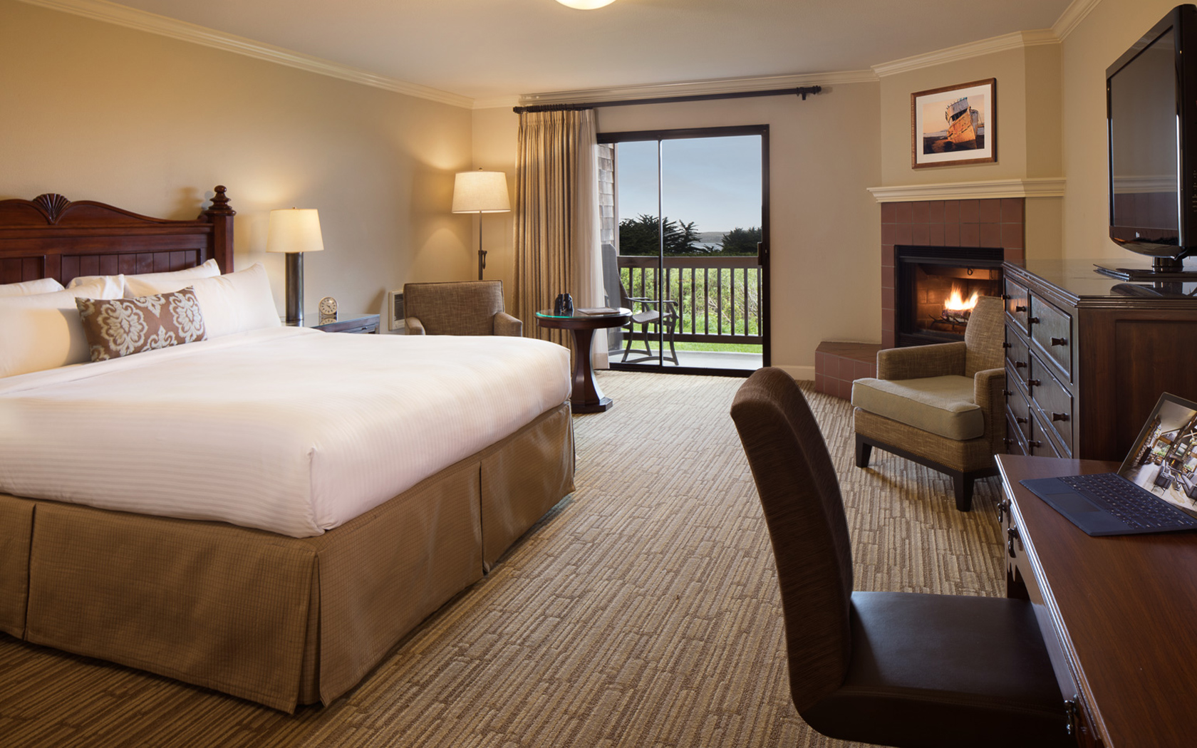 beige painted hotel room with a fire place
