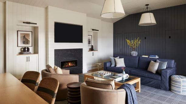 a living room with a fireplace and a couch