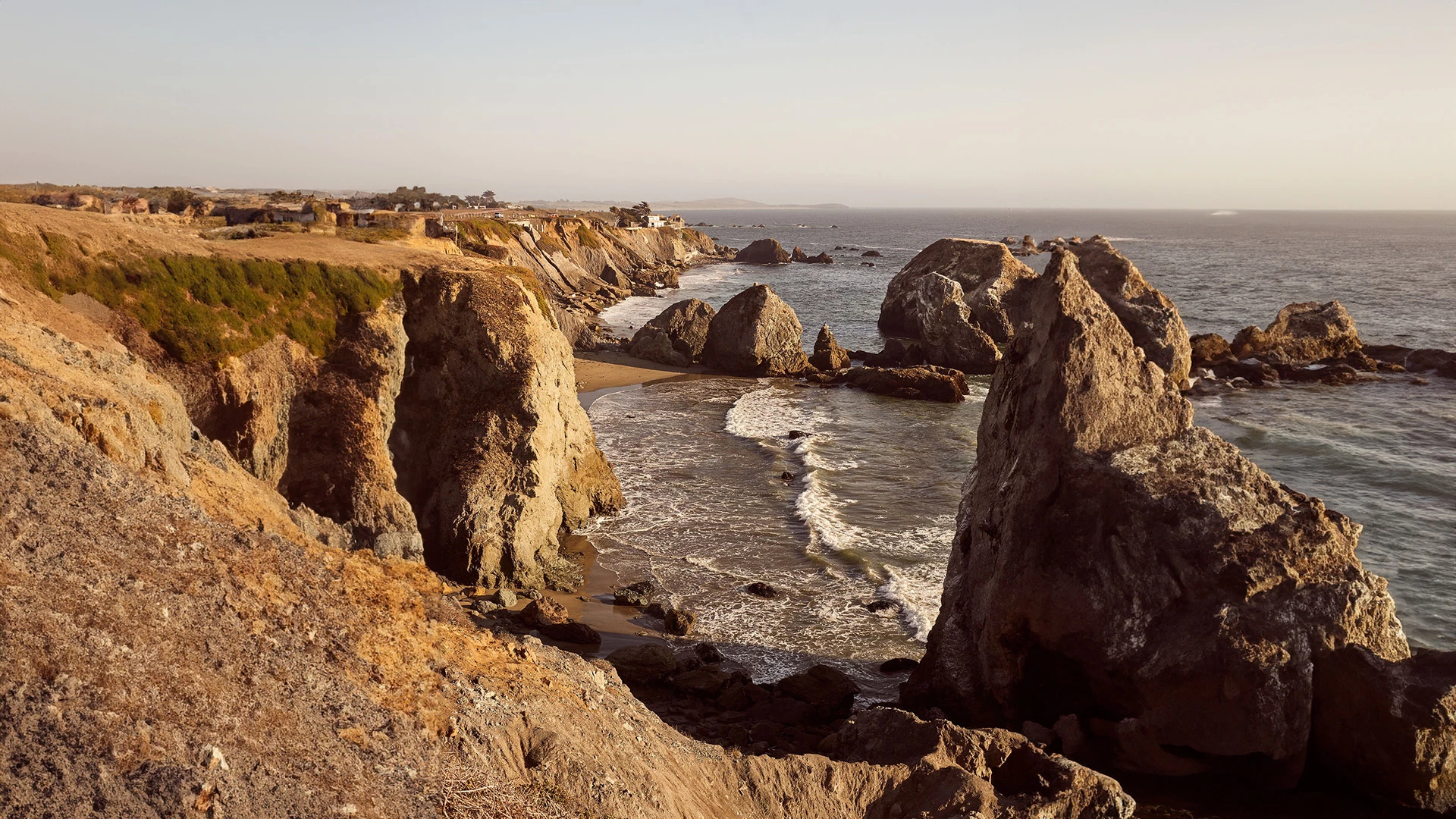 a rocky beach with water and rocks