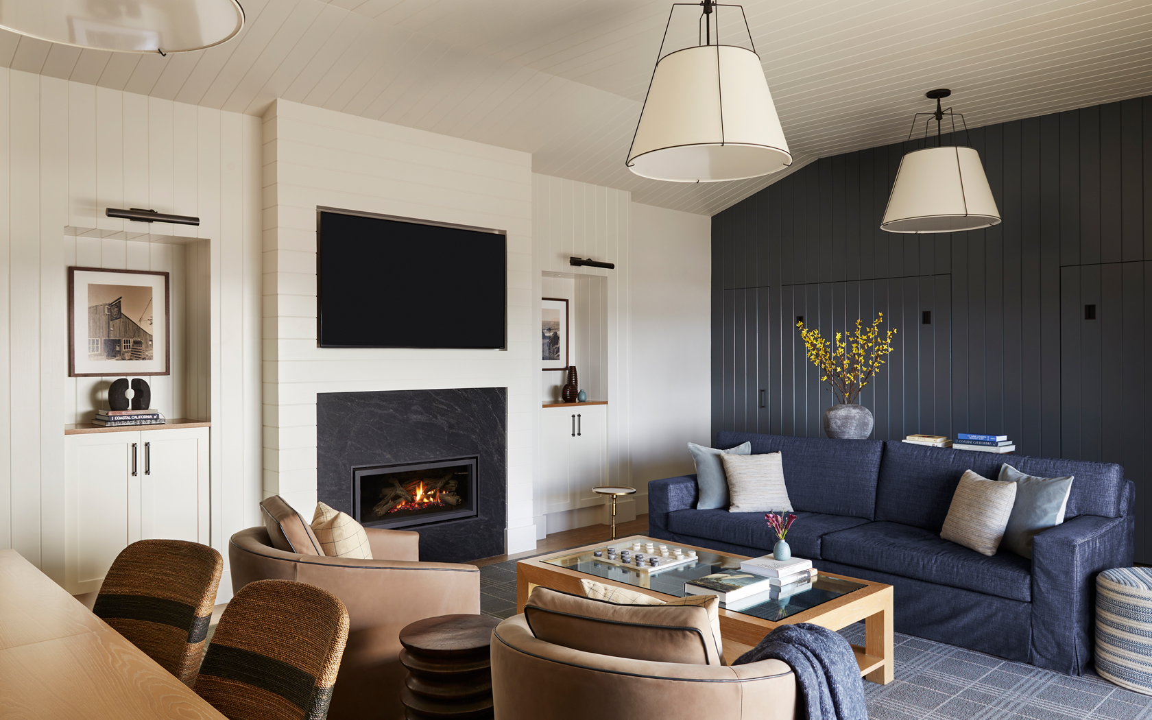a living room with a fireplace and a blue couch