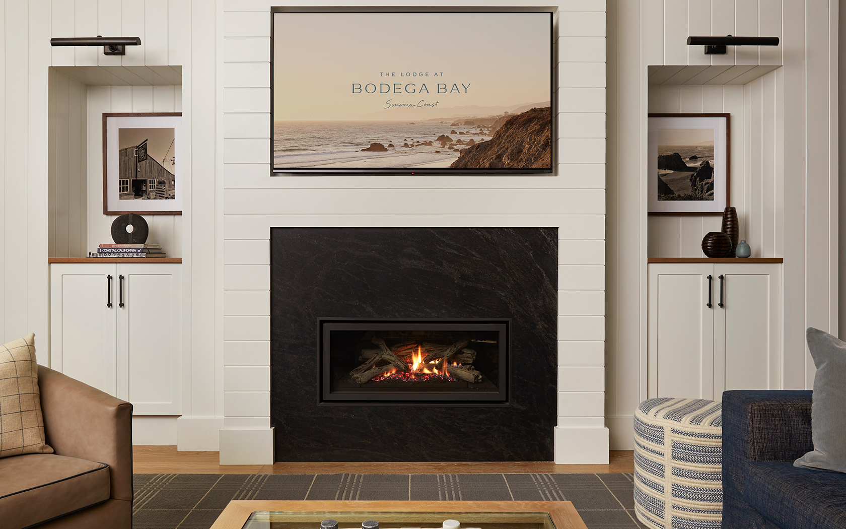 a fireplace with a picture on the wall