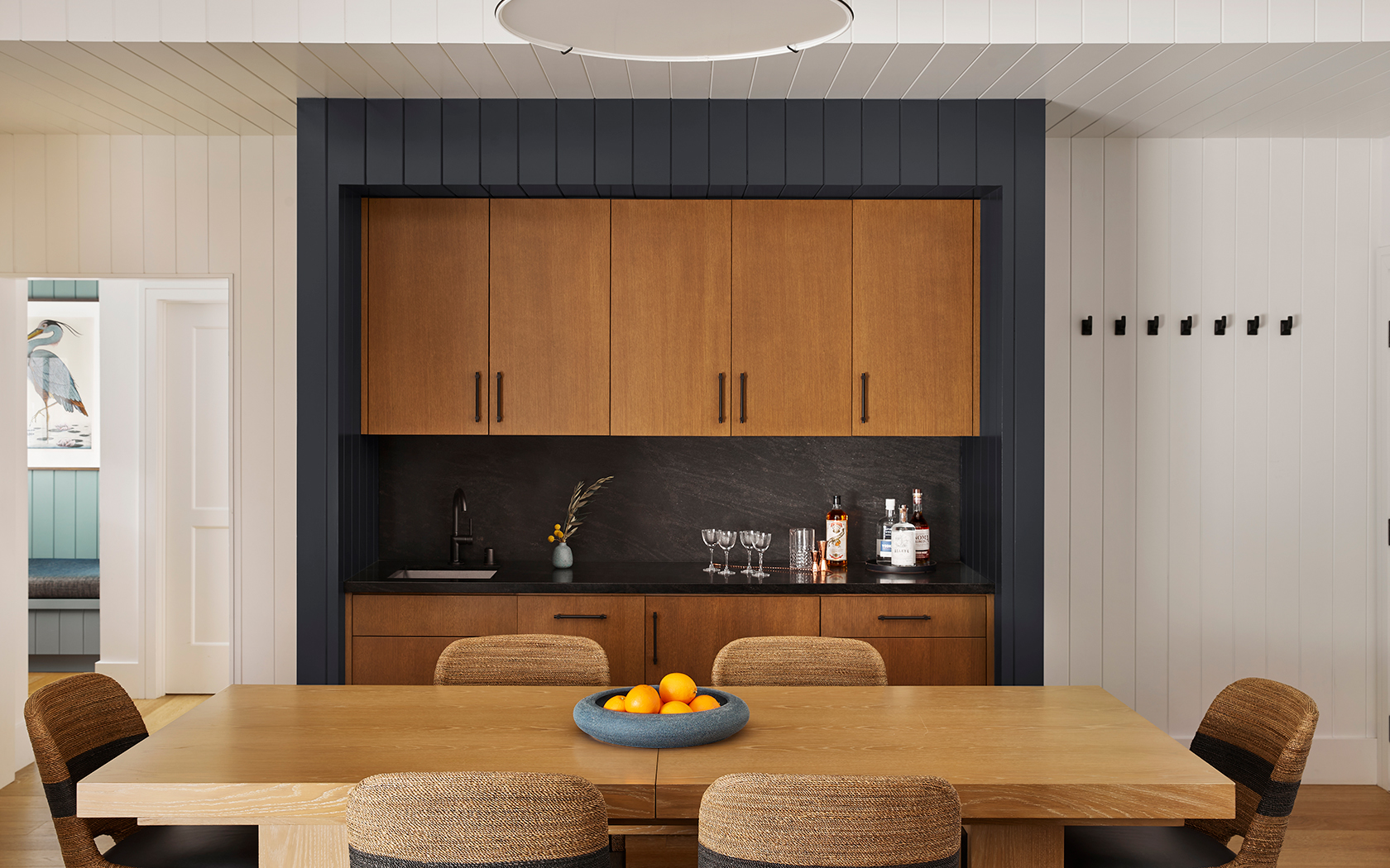 a kitchen with a table and chairs