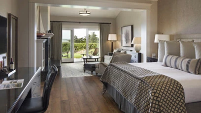 a bedroom with a large glass door