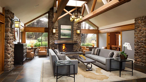 a living room with a fireplace and couches