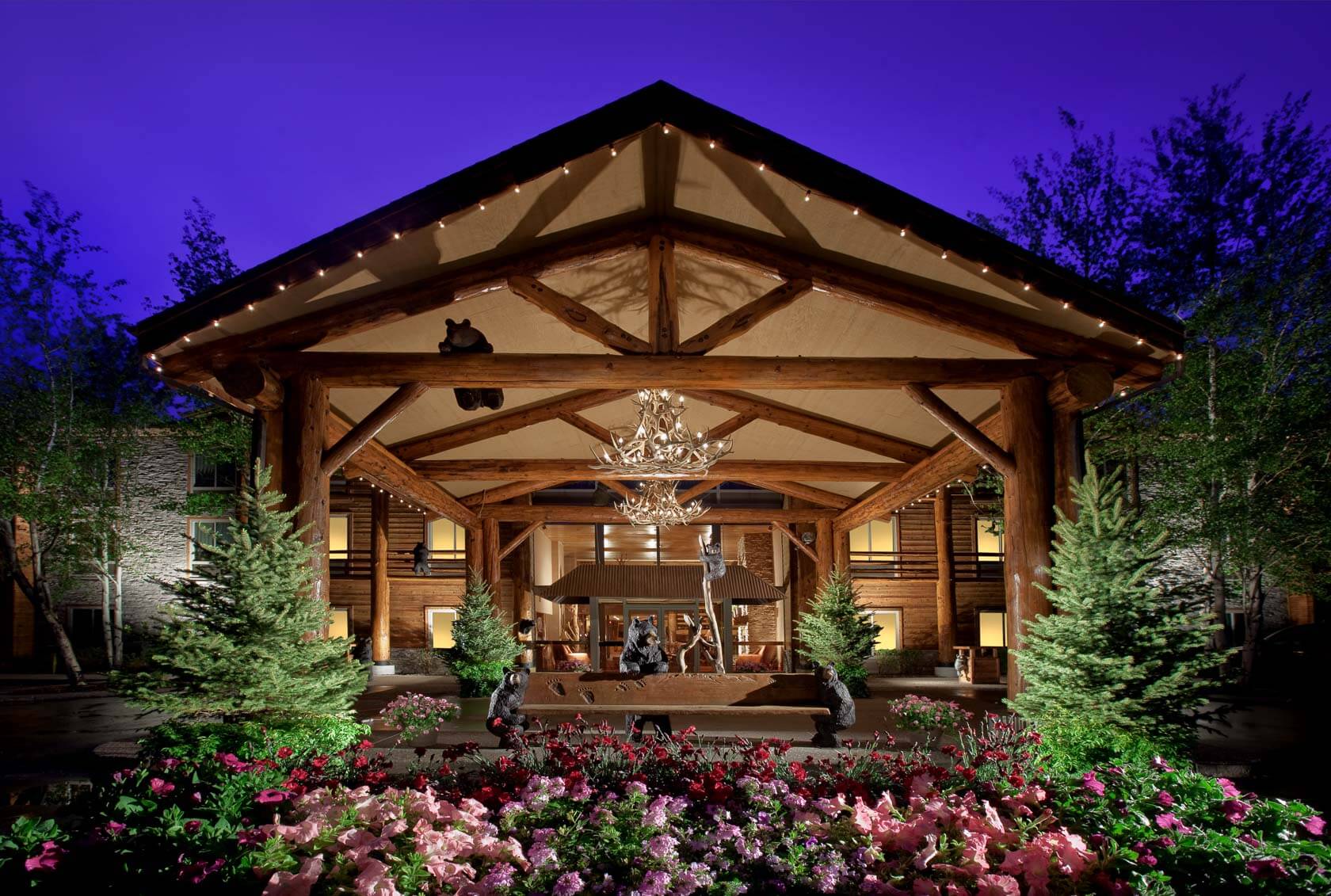 front of the lodge at jackson hole with a garden in front