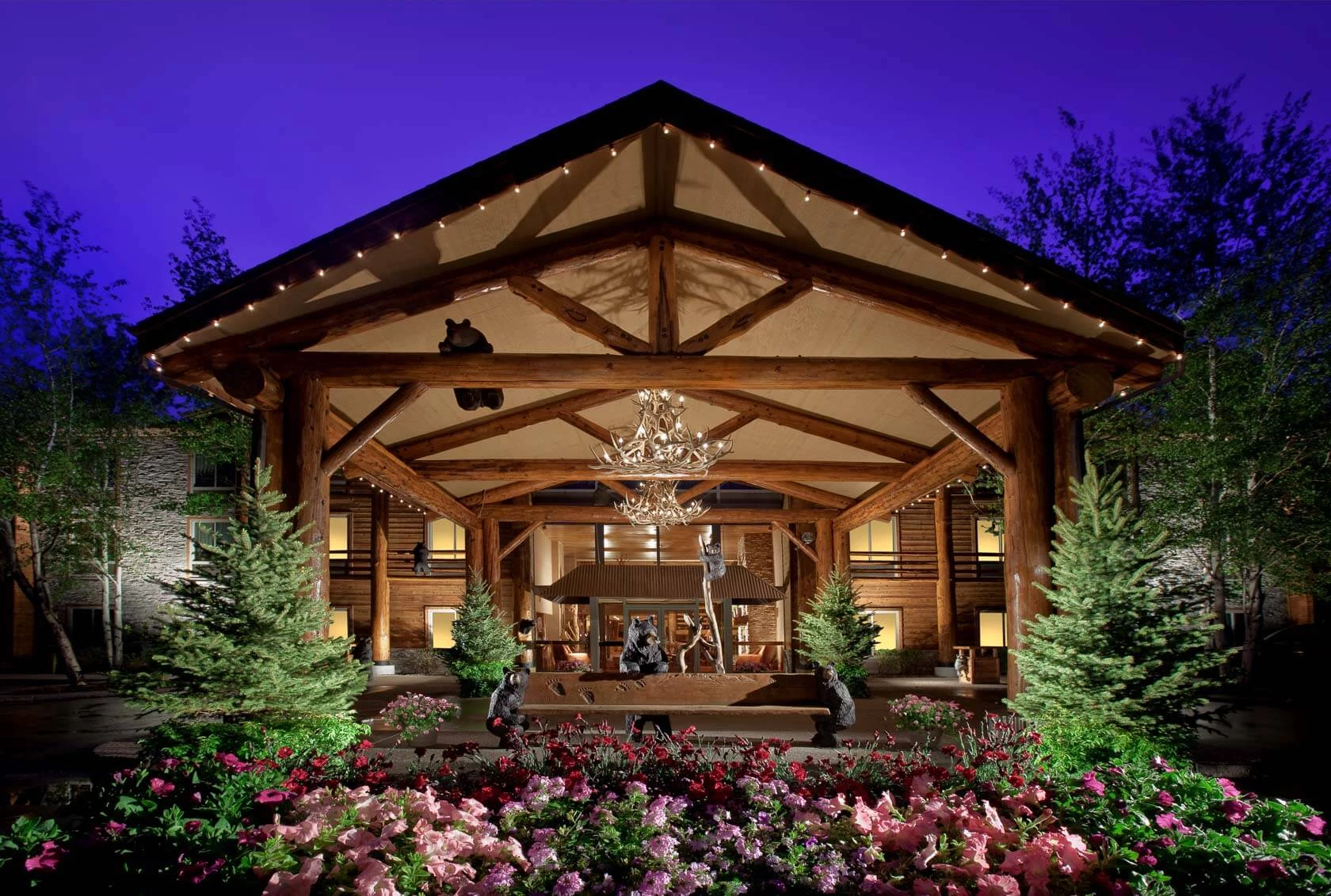 front of the lodge at jackson hole with a garden in front