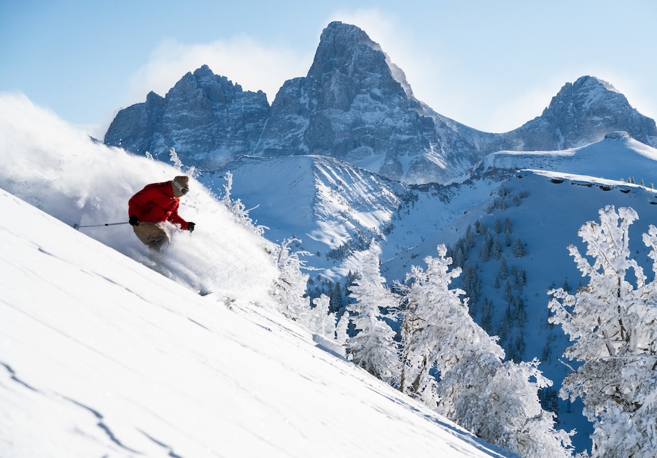 a person skiing down a snowy mountain