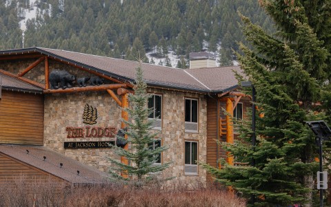 two women walking in front of a building