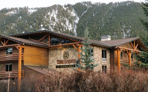 a building with a mountain in the background