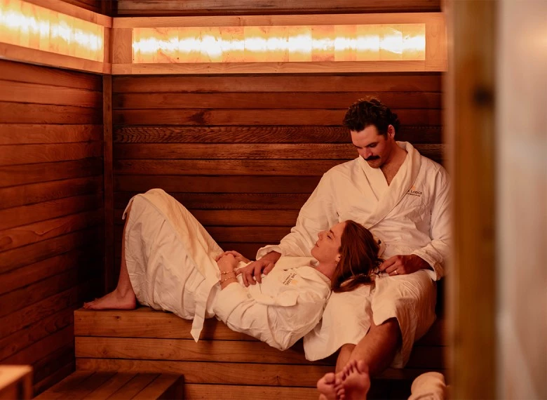 a man and woman in a sauna