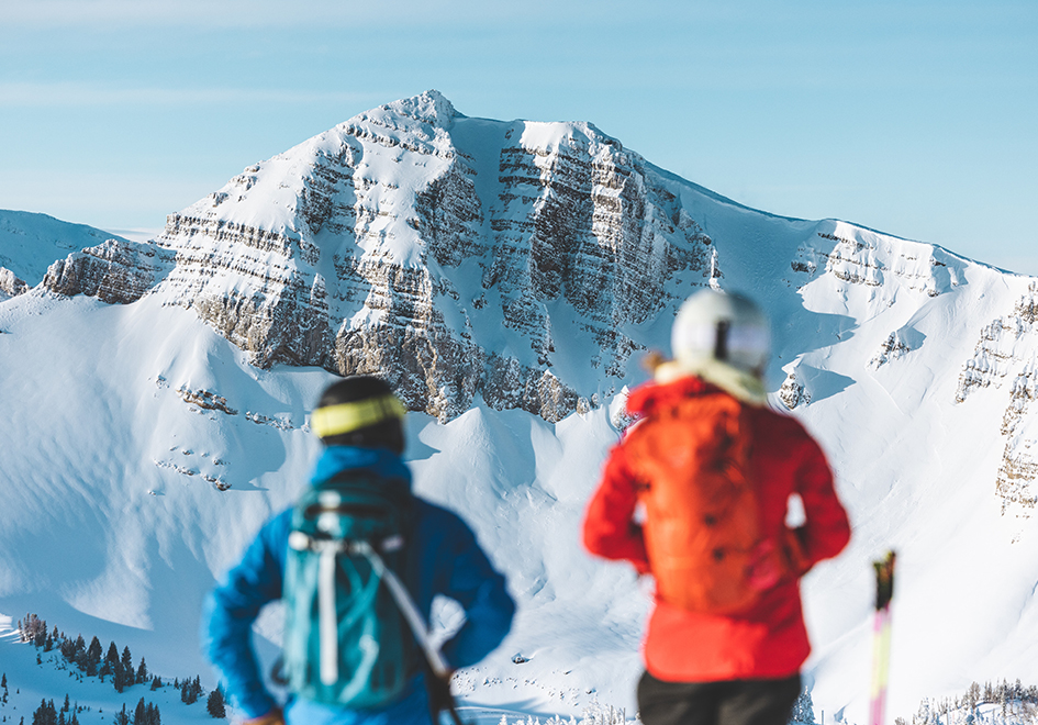 two people on a snowy mountain