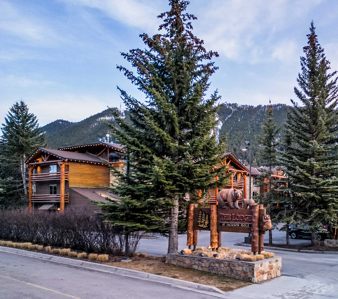 a sign in front of a building