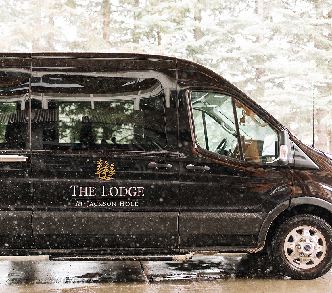 a black van parked in the rain