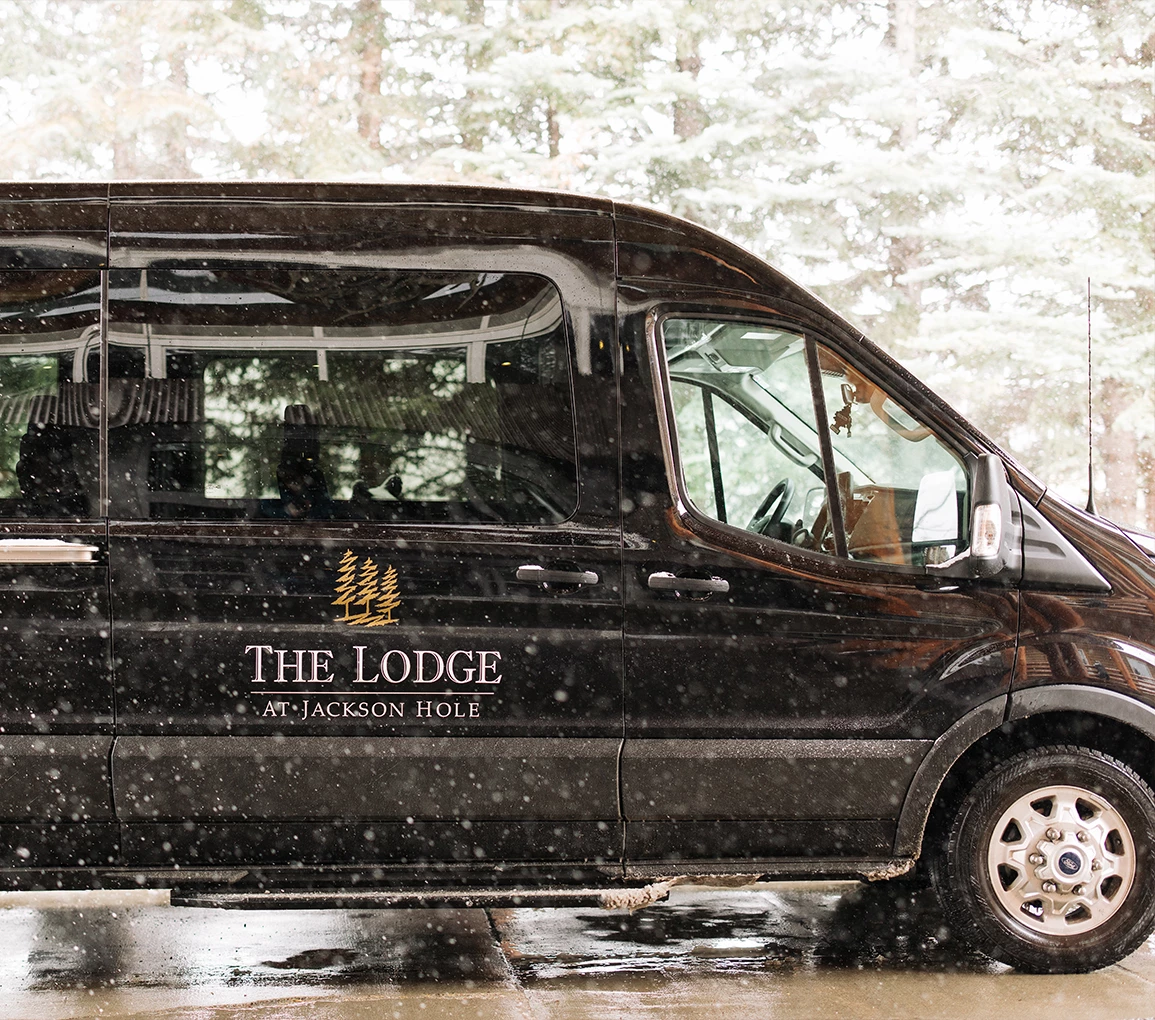 a black van parked in the rain