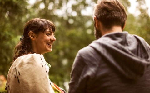 man and woman talking
