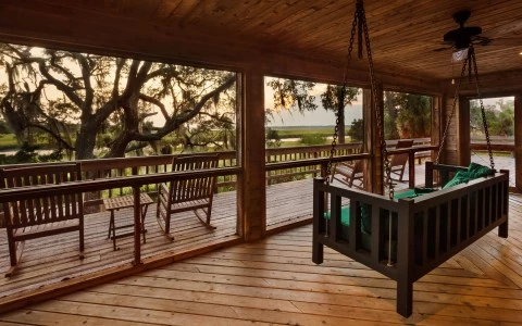 view of porch with porch swing 