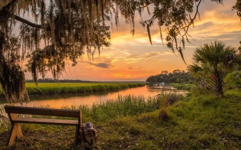 view of sun set with bench 