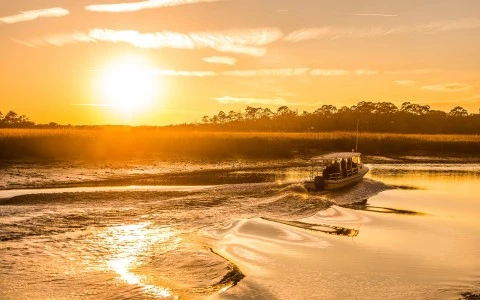 people boating during the sun set