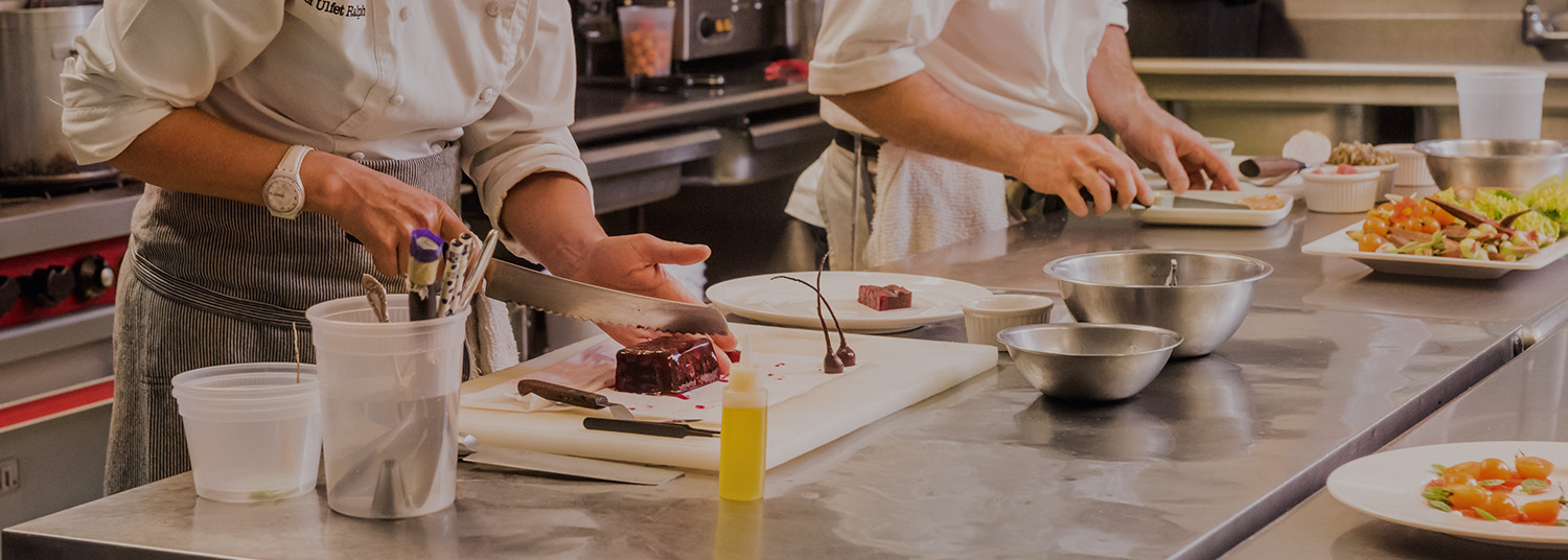 two chefs preparing food