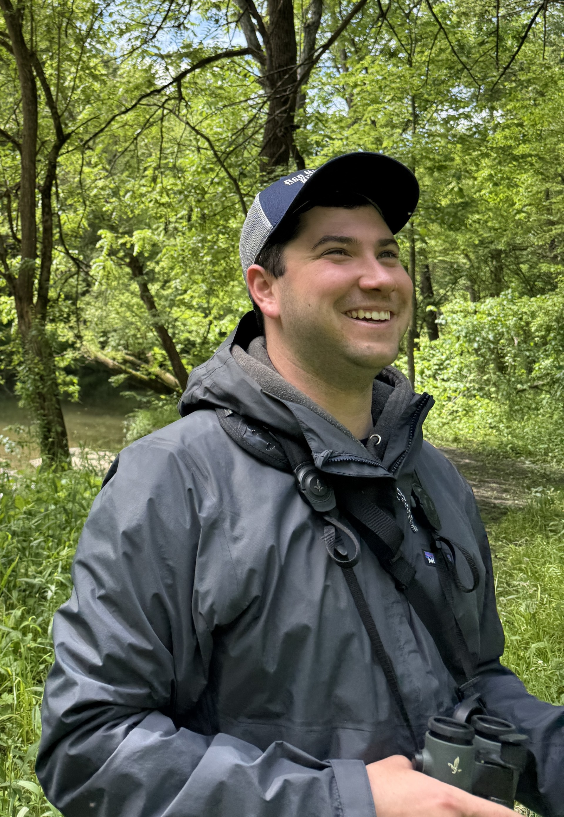 a man in a hat and jacket