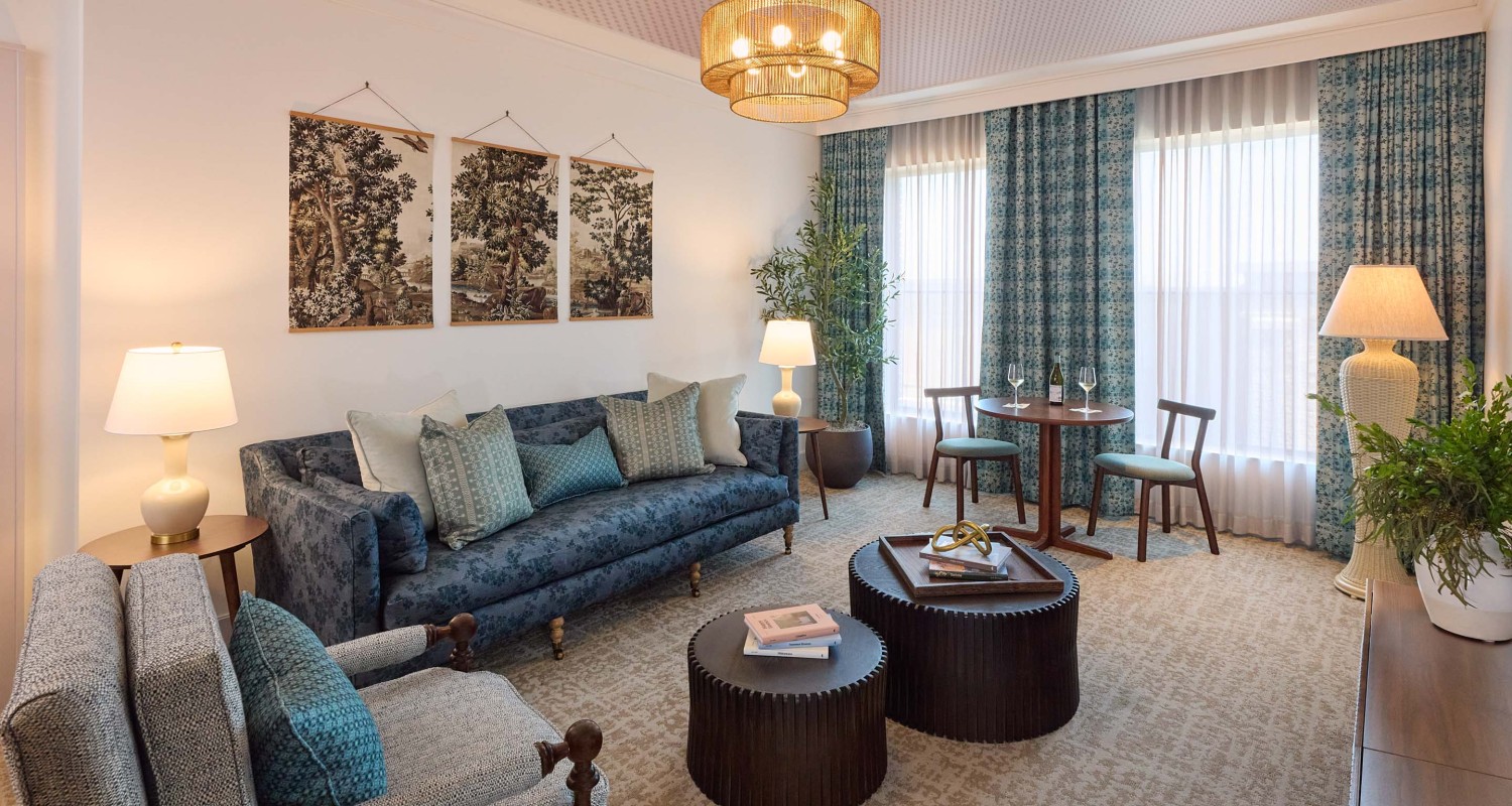a living room with a couch and chairs