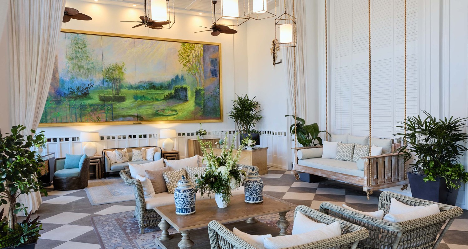 a room with a painting and couches