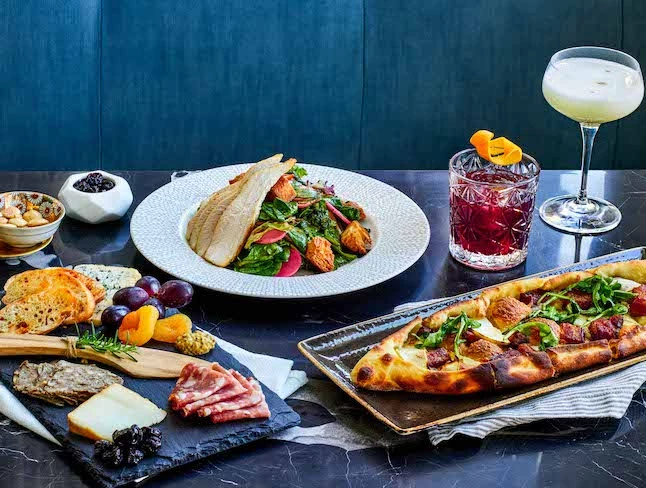 A table with various food and drinks